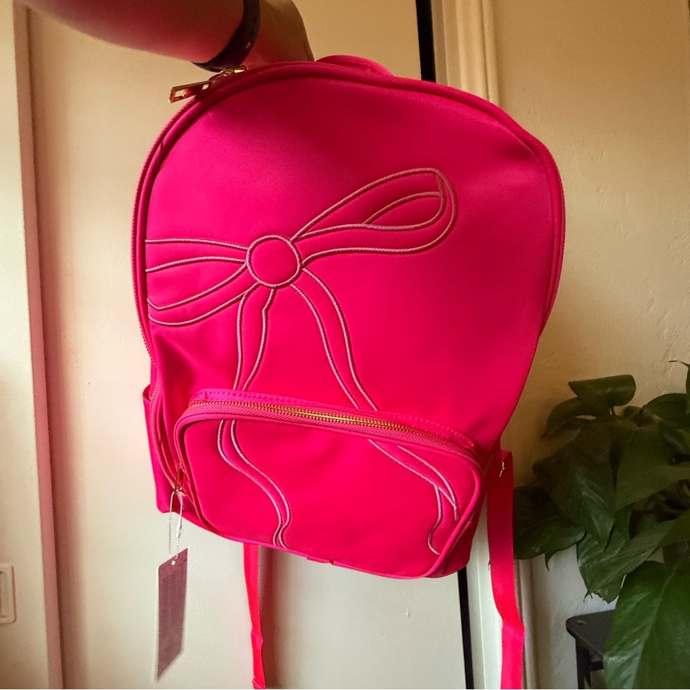 Bright pink bow backpack